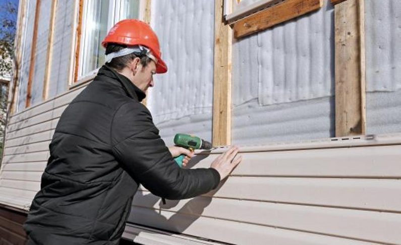 Pose verticale avec couvre-joint : le style grange rénovée